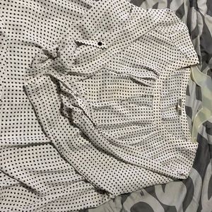 White silky top with black square “polka dots”